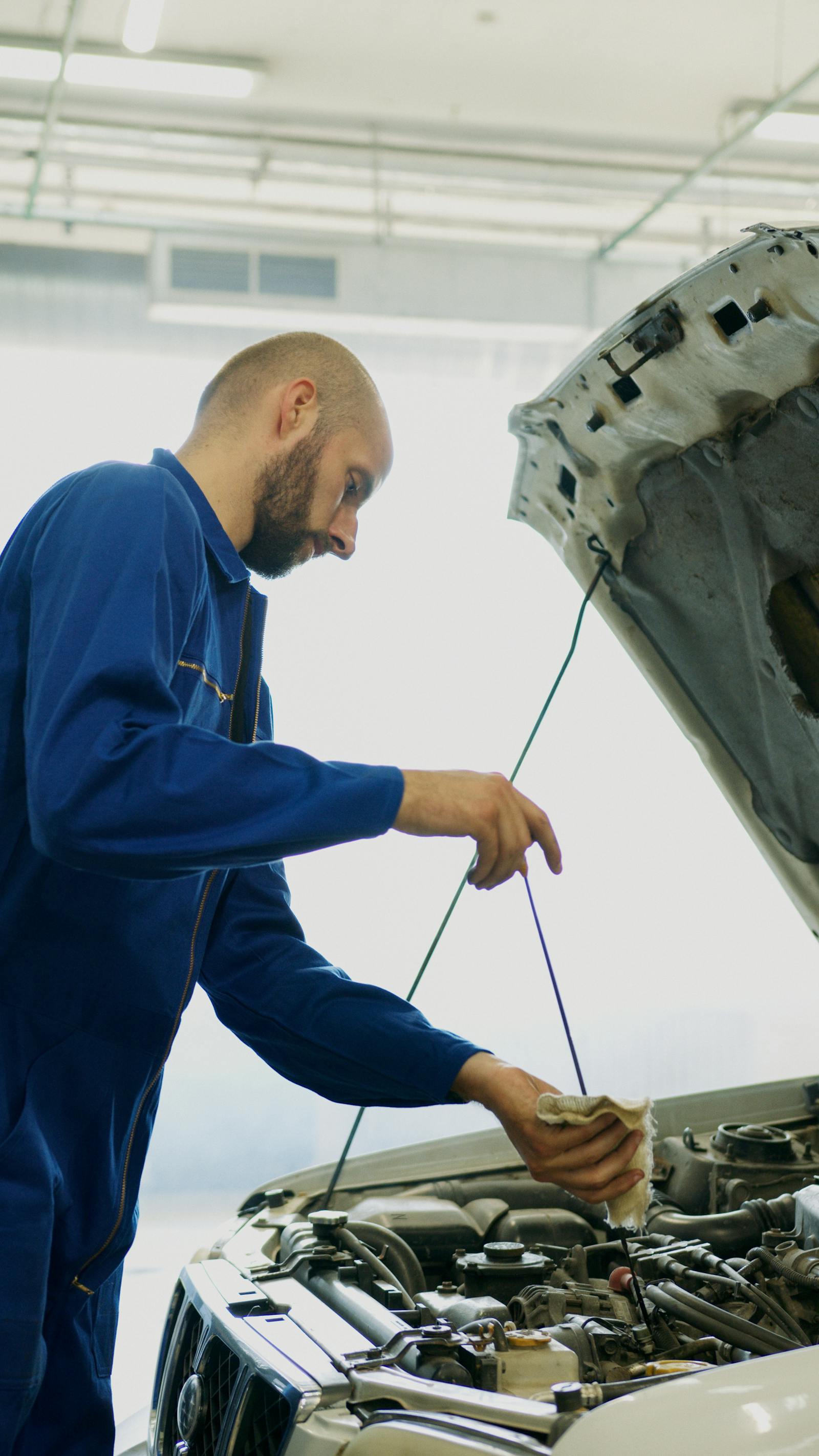 SpeeDee technician performing an oil change